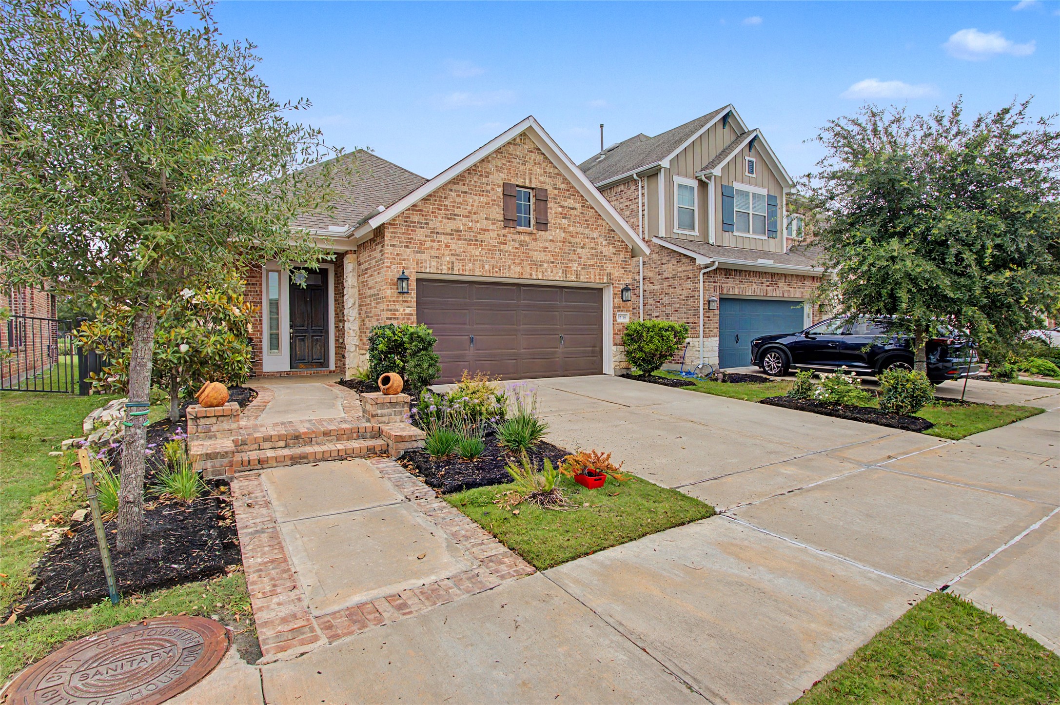 19718 Shinnery Ridge Court Cypress, TX 77433 - Photo 23 of 23 a front view of a house with a yard and a garage