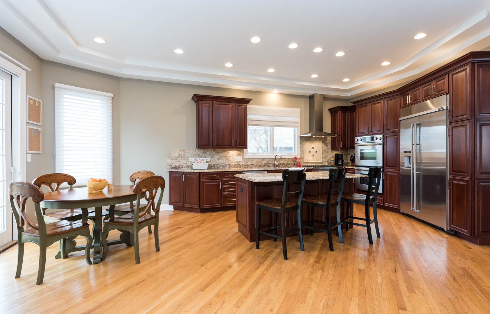1330 Kenton Road Deerfield, IL 60015 - Photo 3 of 24 a view of a dining room with furniture and wooden floor