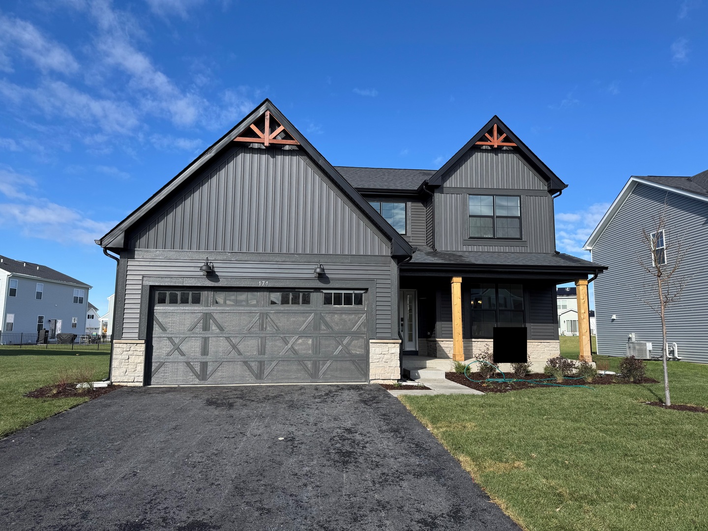171 Piper Glen Avenue Oswego, IL 60543 - Photo 1 of 31 a front view of a house with garden
