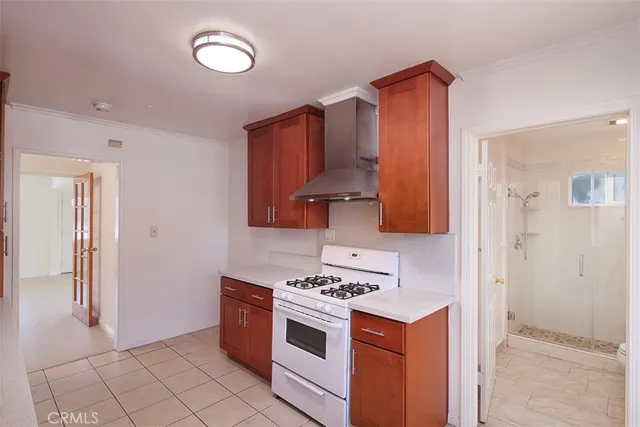 a kitchen with a stove and a refrigerator