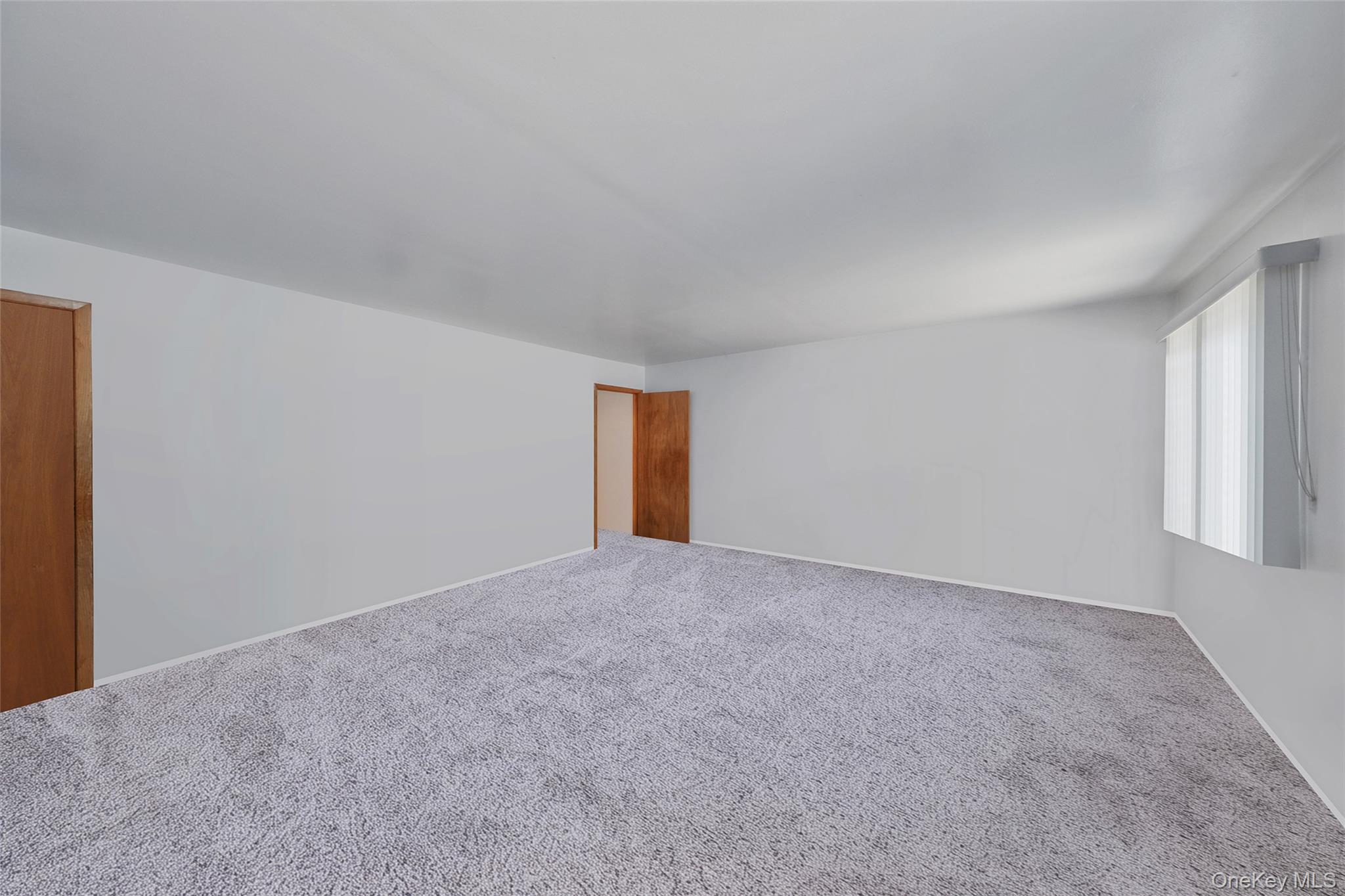 59 Maybrook Road North Babylon, NY 11703 - Photo 32 of 43 a view of an empty room and window