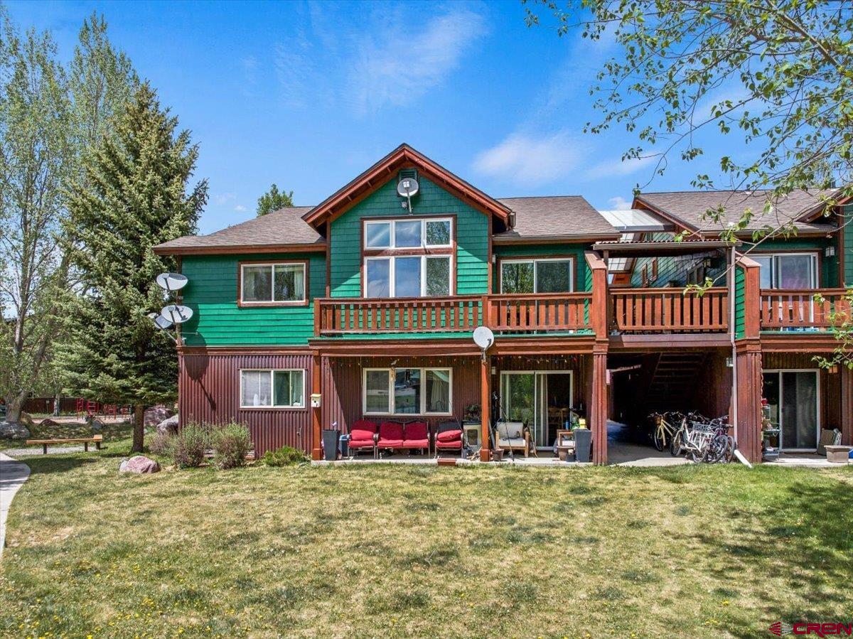 520 Redcliff Circle, Unit G203 Ridgway, CO 81432 - Photo 25 of 25 a front view of a house with a yard