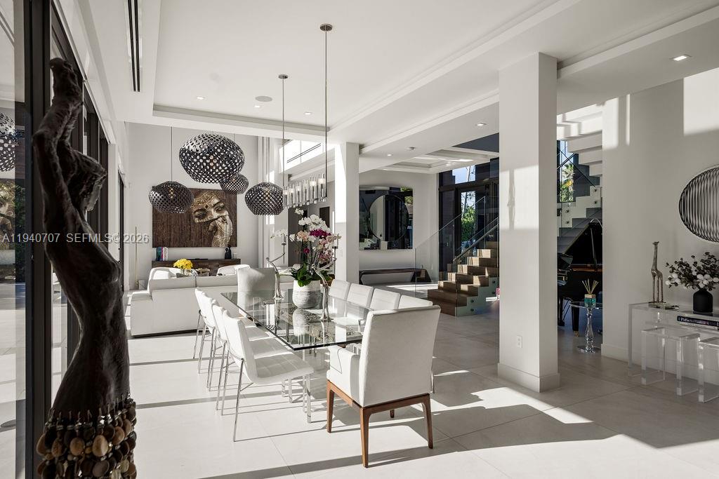 6850 Southwest 73rd Court Miami, FL 33143 - Photo 13 of 52 a view of a dining room with furniture and chandelier