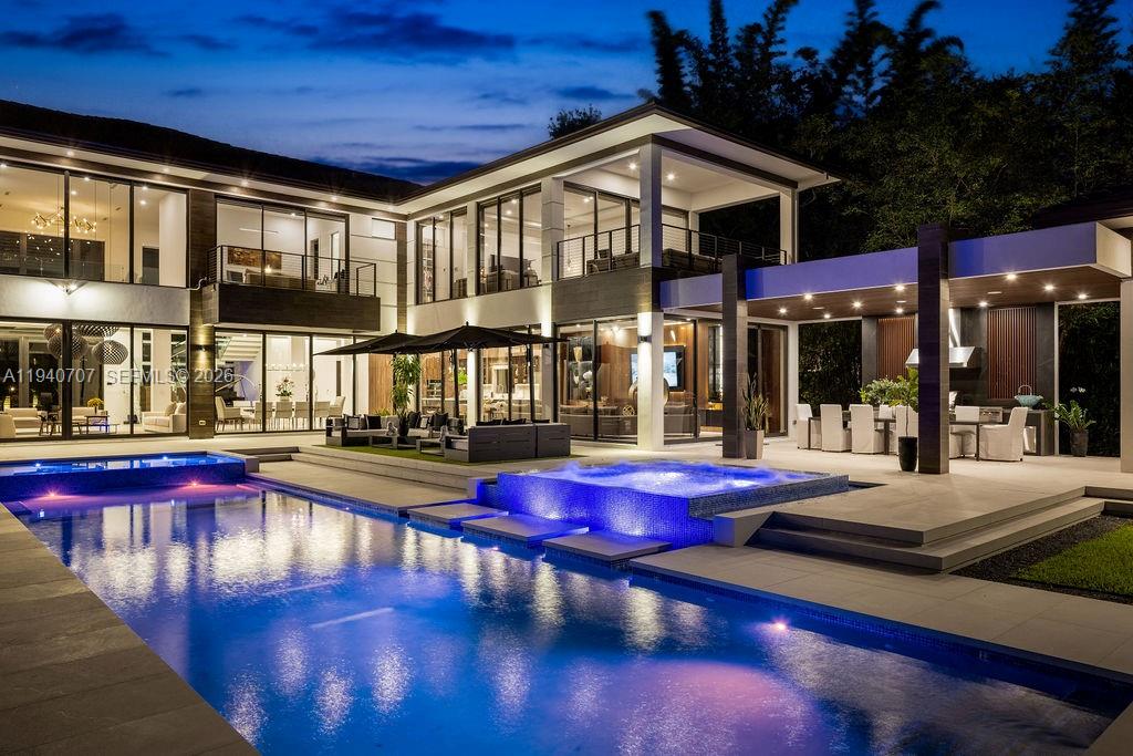 6850 Southwest 73rd Court Miami, FL 33143 - Photo 2 of 52 a view of swimming pool with outdoor seating