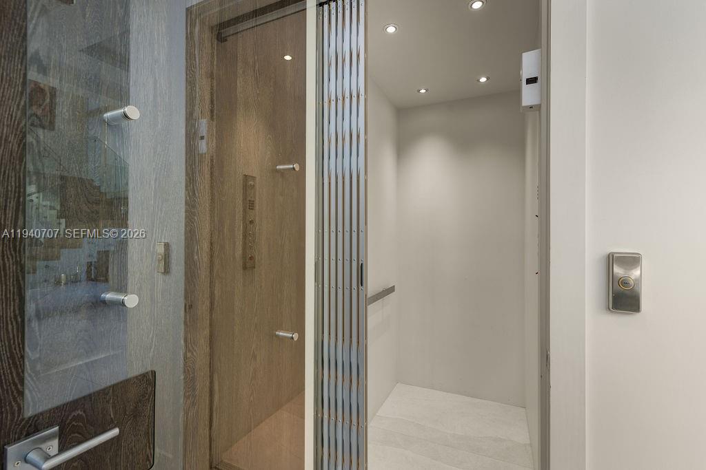 6850 Southwest 73rd Court Miami, FL 33143 - Photo 22 of 52 a bathroom with a glass shower door