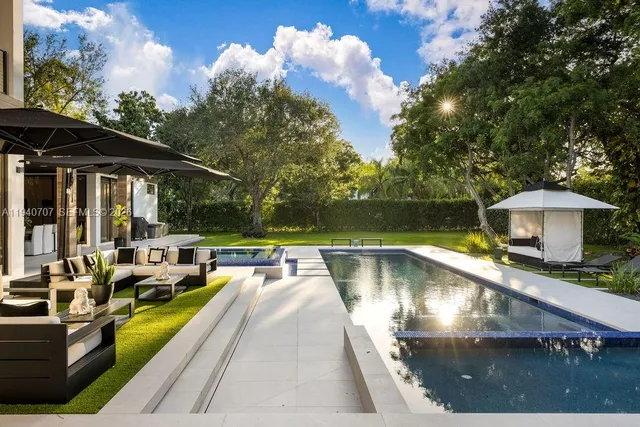 a view of a swimming pool with a patio
