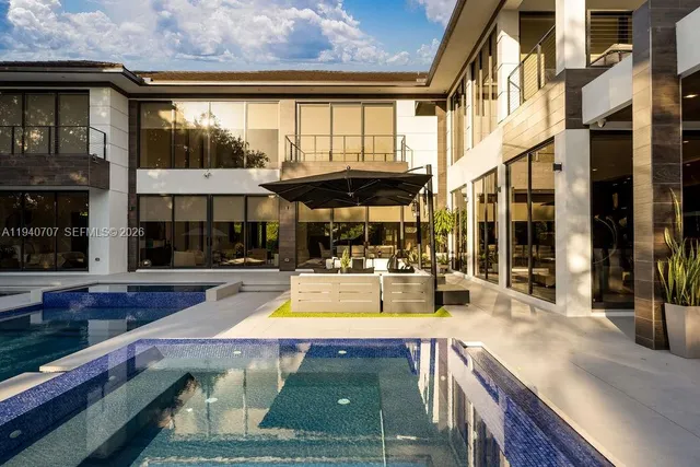 a view of a house with sitting area and furniture