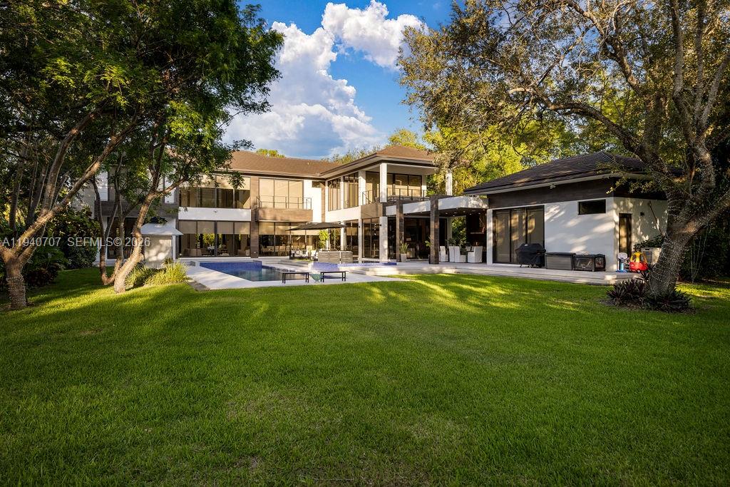 6850 Southwest 73rd Court Miami, FL 33143 - Photo 38 of 52 a view of a house with a big yard patio and large trees