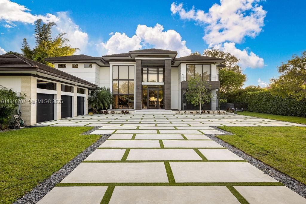 6850 Southwest 73rd Court Miami, FL 33143 - Photo 42 of 52 a view of a white house with a yard