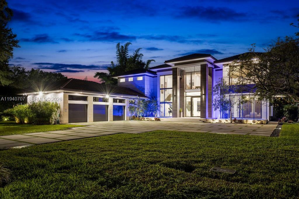 6850 Southwest 73rd Court Miami, FL 33143 - Photo 44 of 52 a front view of a house with a yard
