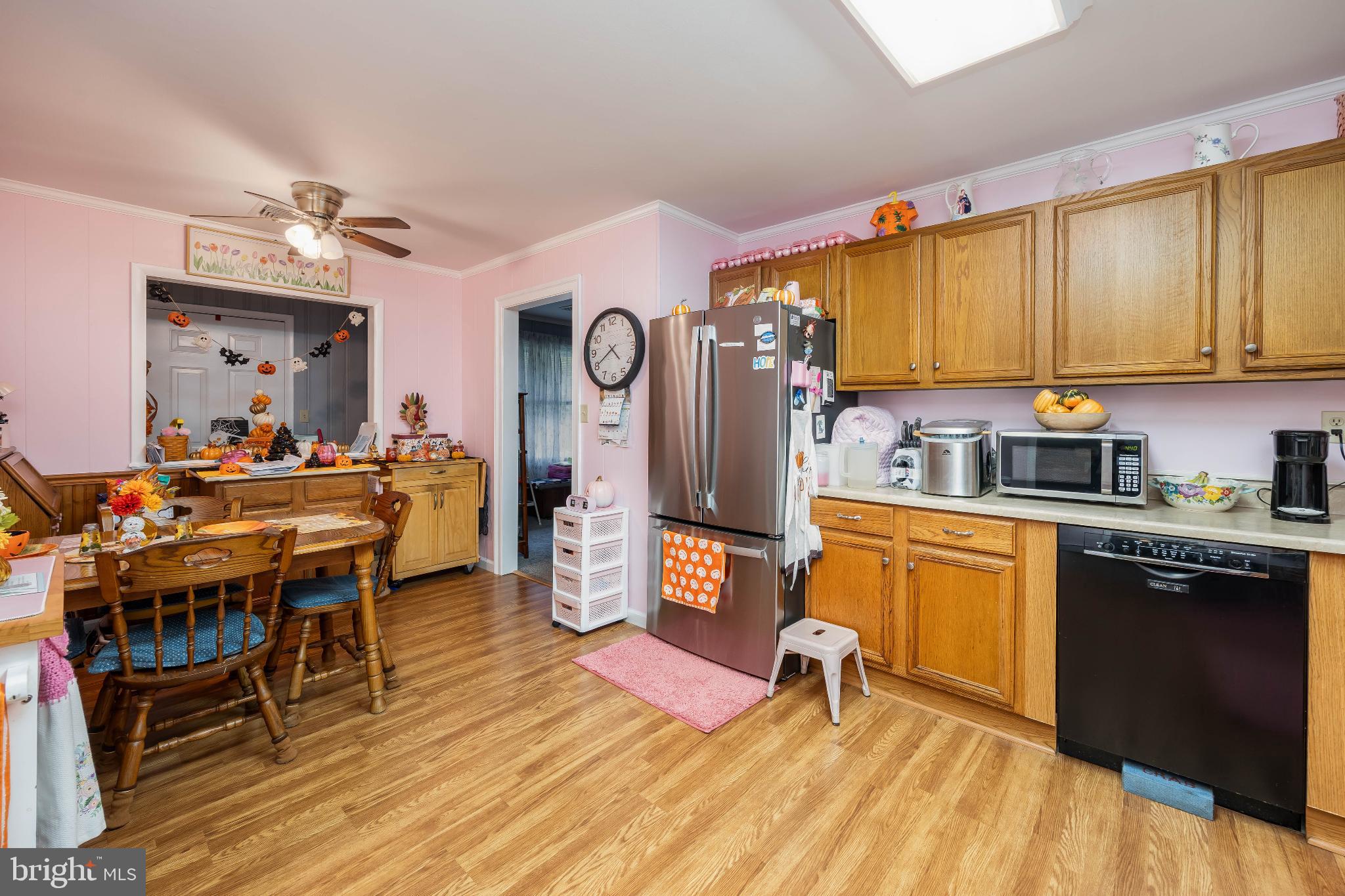 136 Marvel Road Salisbury, MD 21801 - Photo 11 of 42 a kitchen with stainless steel appliances wooden floors stove top oven and cabinets