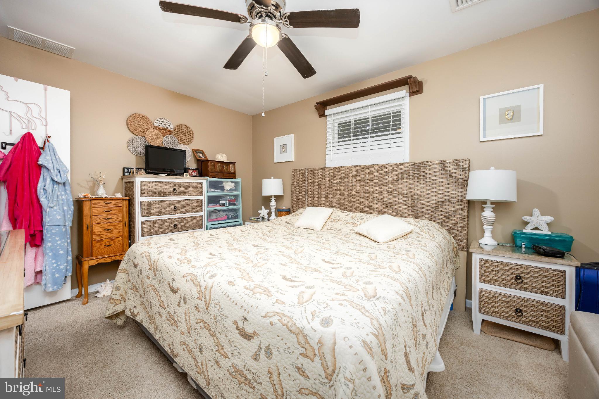 136 Marvel Road Salisbury, MD 21801 - Photo 22 of 42 a bedroom with a bed and wooden floor