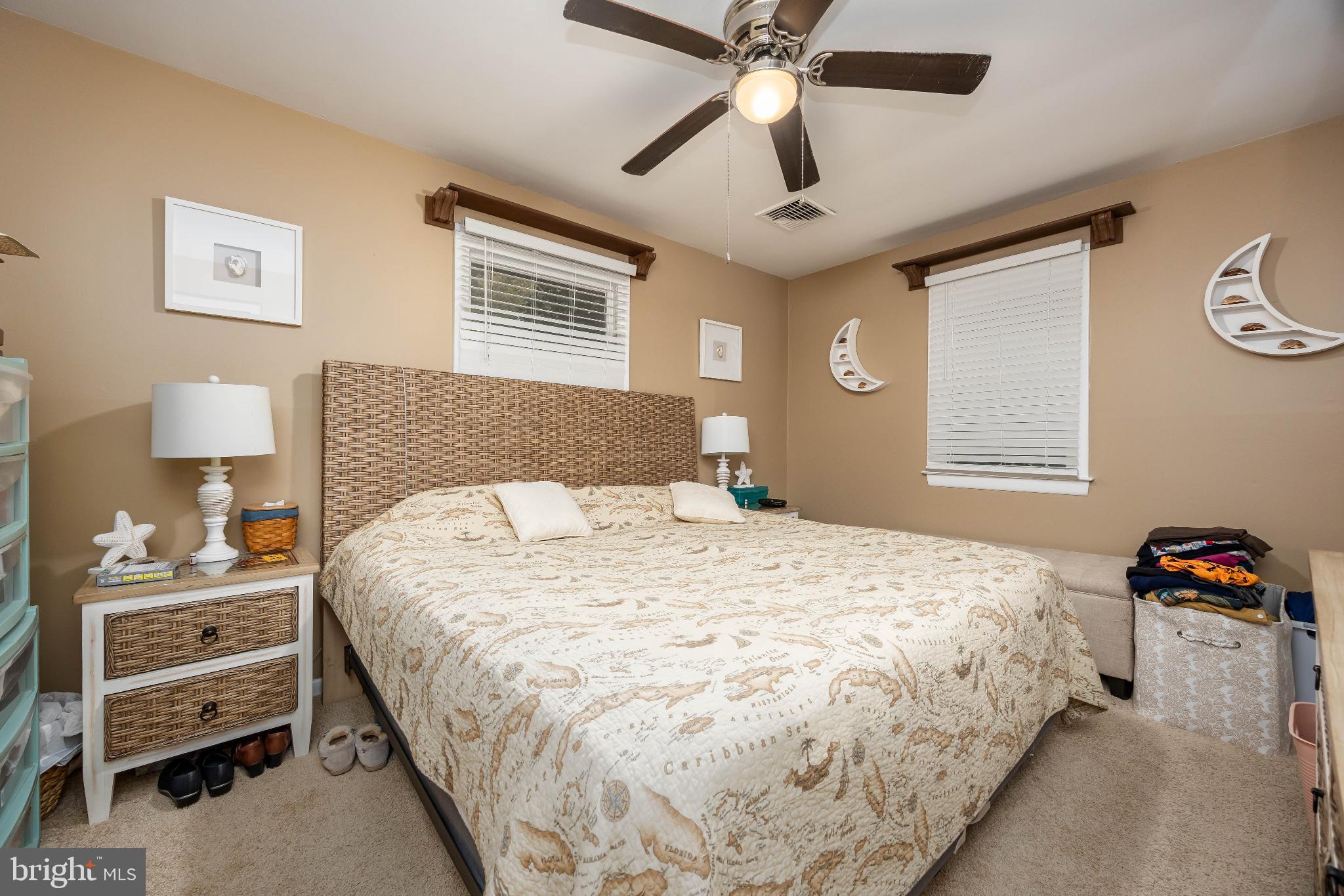 136 Marvel Road Salisbury, MD 21801 - Photo 24 of 42 a bedroom with a bed and a chandelier