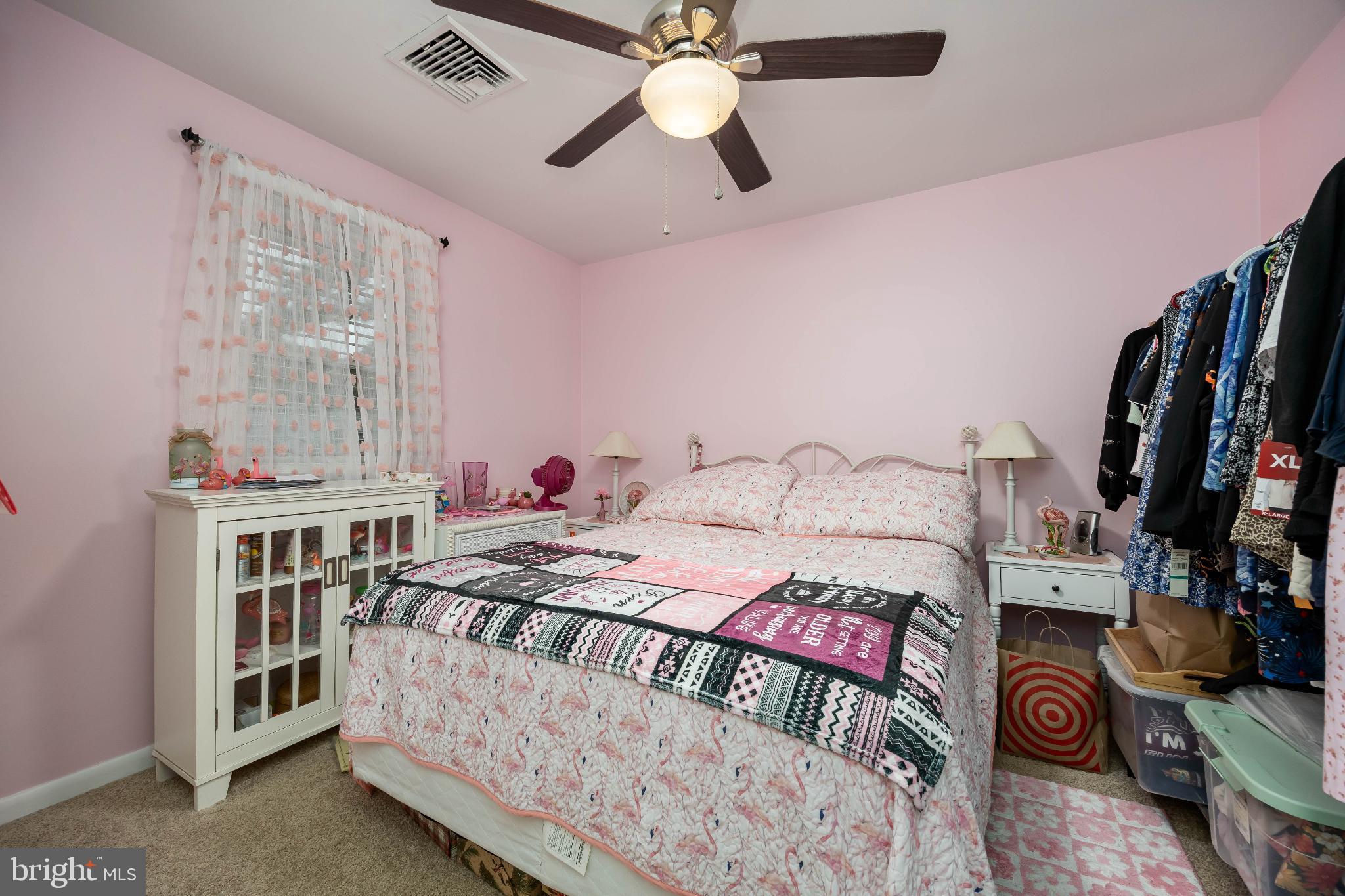 136 Marvel Road Salisbury, MD 21801 - Photo 26 of 42 a bedroom with a bed and a chandelier