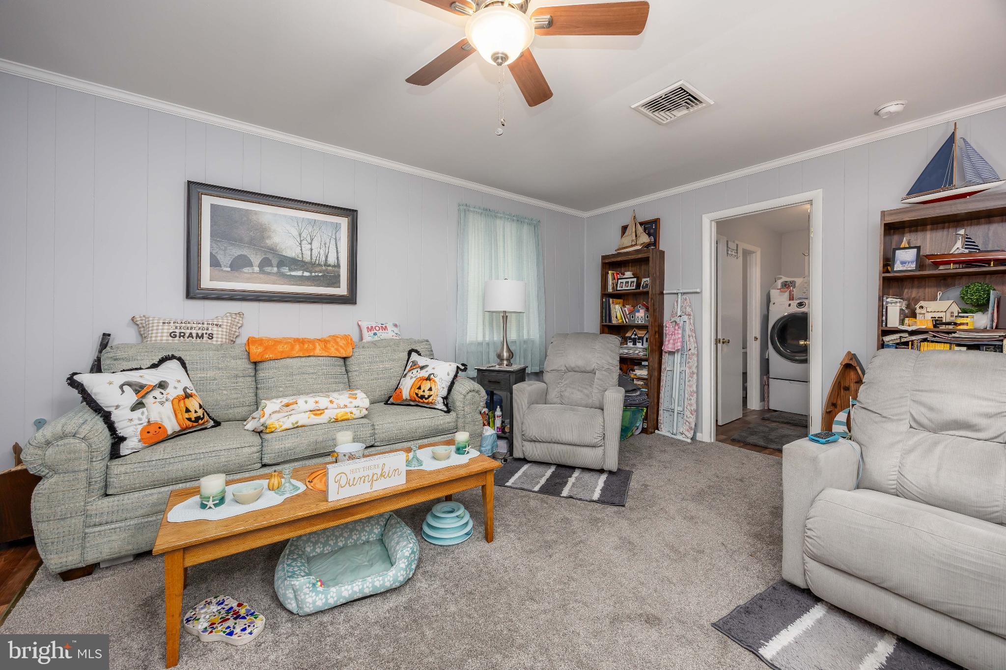 136 Marvel Road Salisbury, MD 21801 - Photo 6 of 42 a living room with furniture and a book shelf