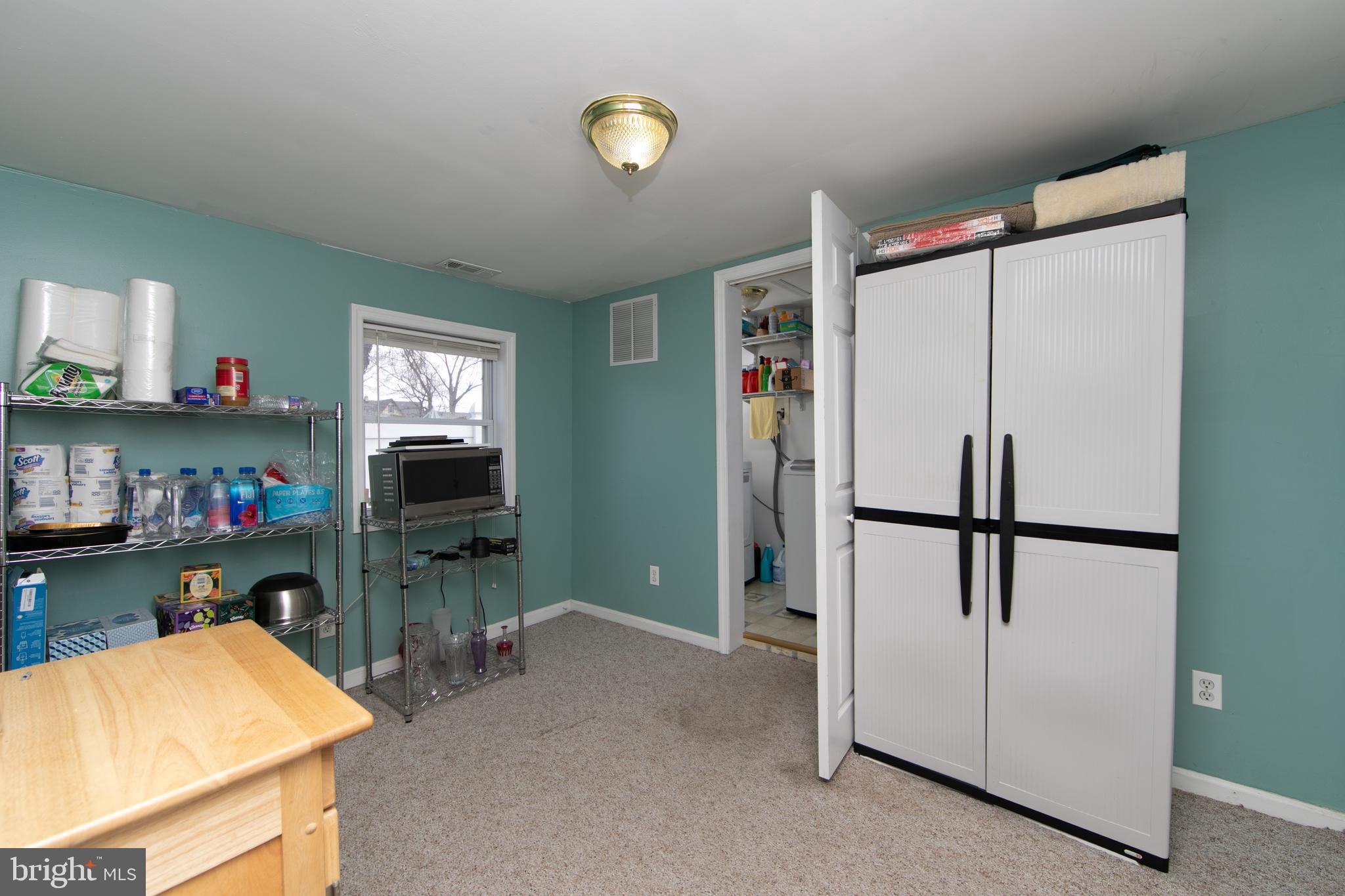 614 West 5th Street Palmyra, NJ 08065 - Photo 15 of 30 a kitchen with refrigerator a table and chairs
