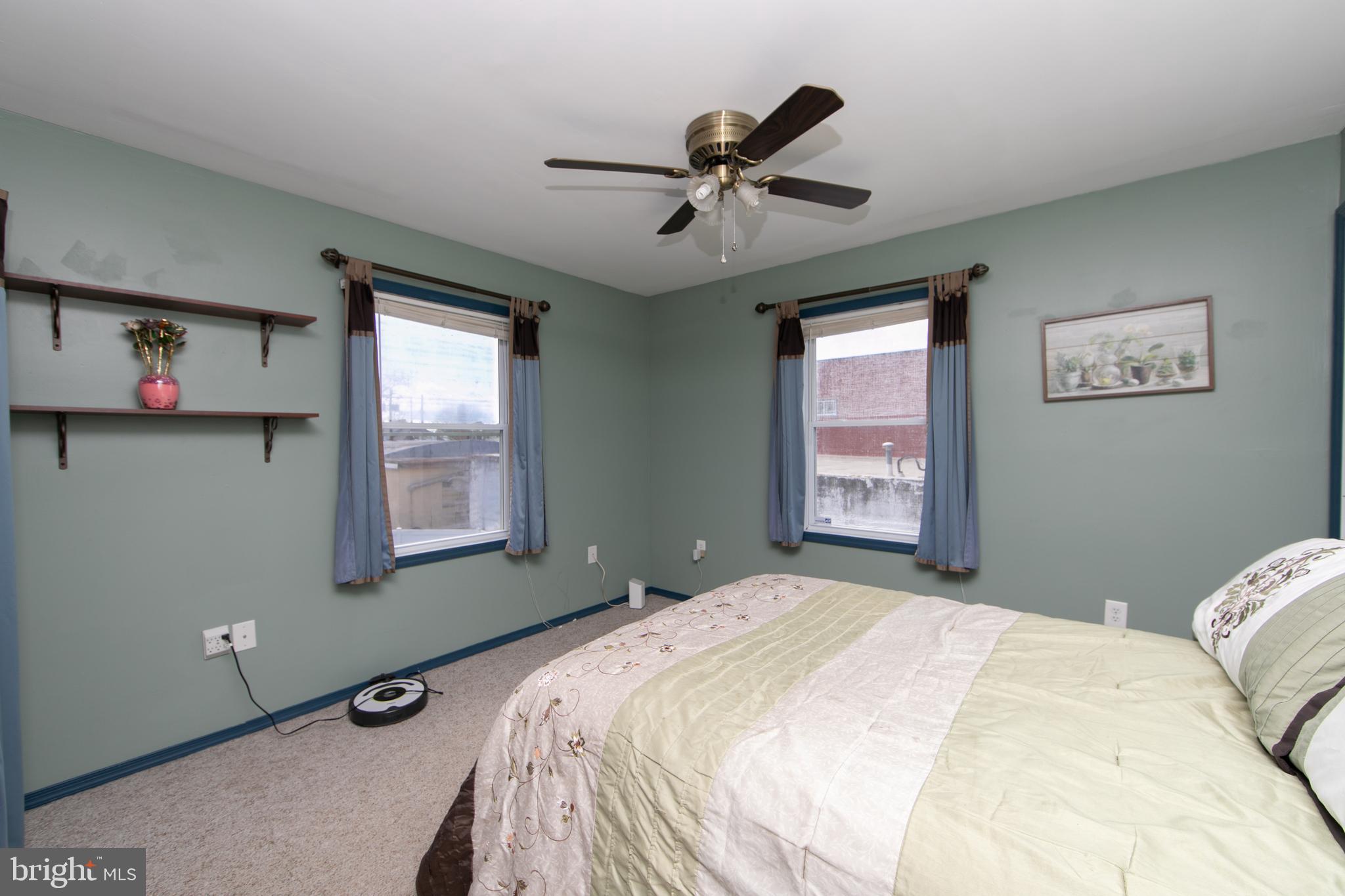 614 West 5th Street Palmyra, NJ 08065 - Photo 19 of 30 a bedroom with a bed and a window
