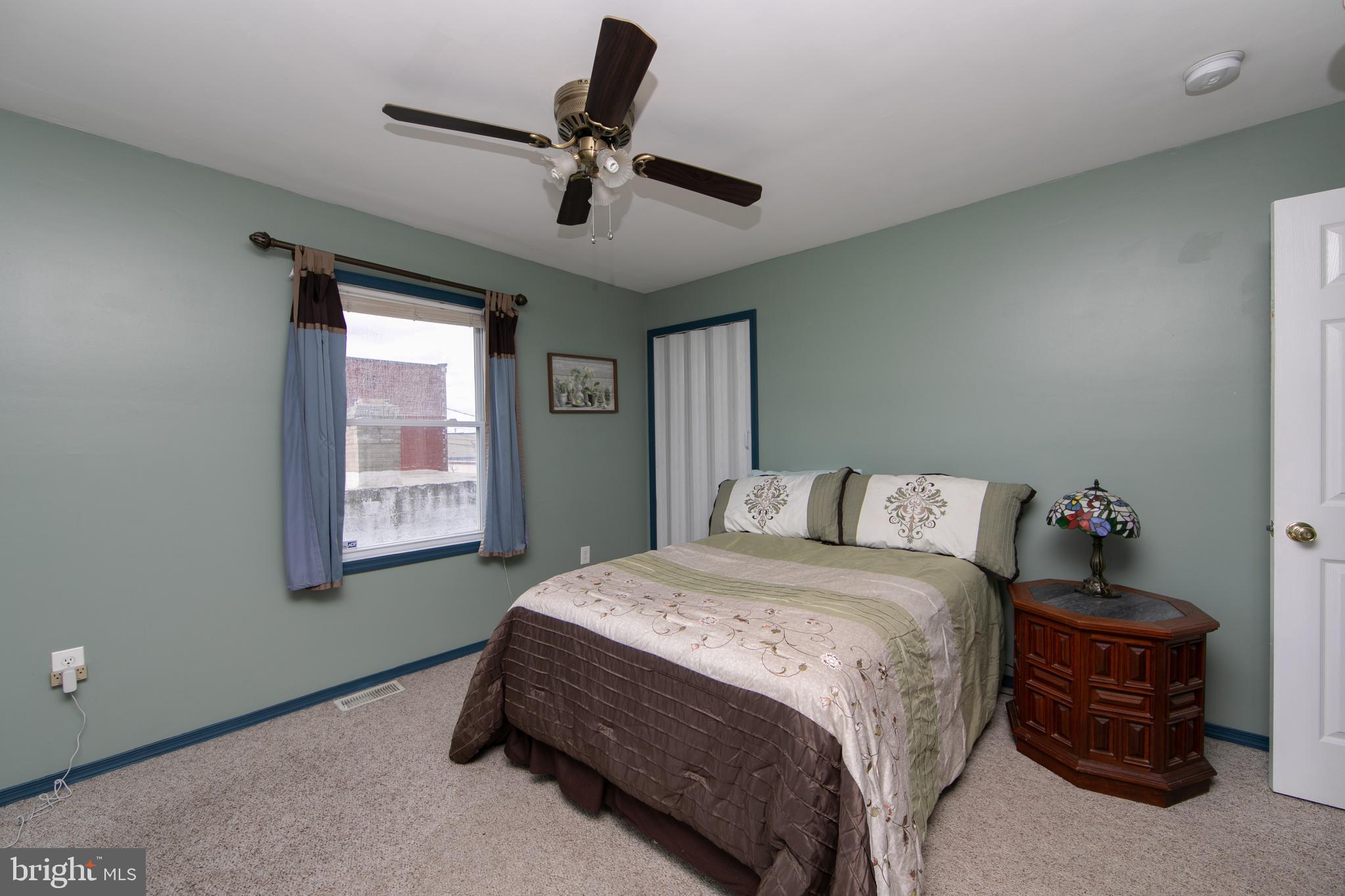 614 West 5th Street Palmyra, NJ 08065 - Photo 20 of 30 a bedroom with a bed dresser and a window