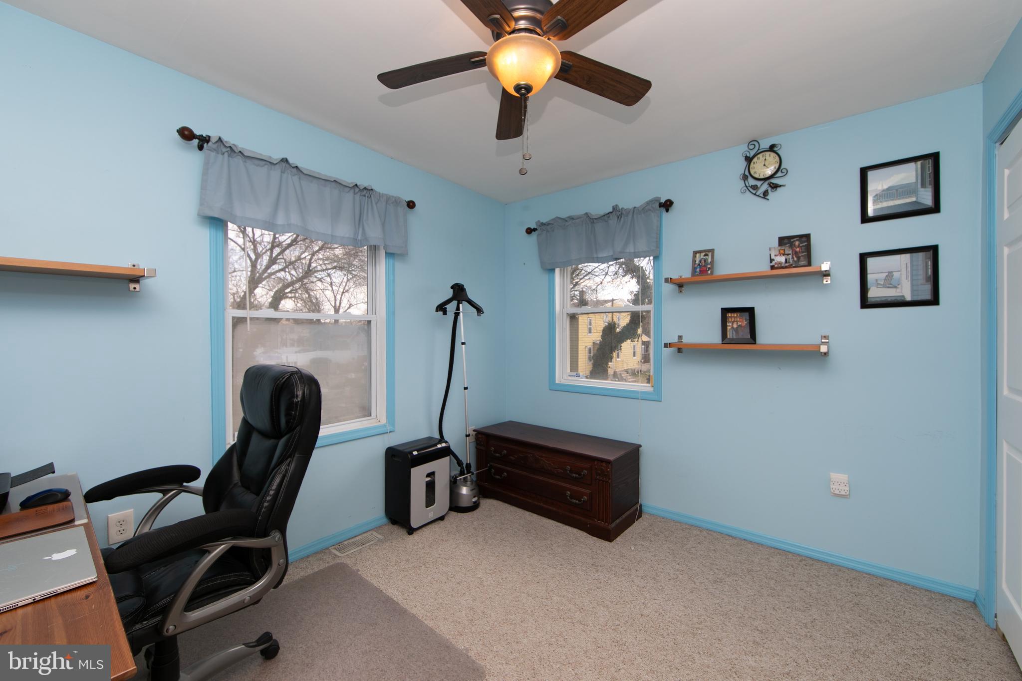 614 West 5th Street Palmyra, NJ 08065 - Photo 22 of 30 a living room with furniture and a chandelier
