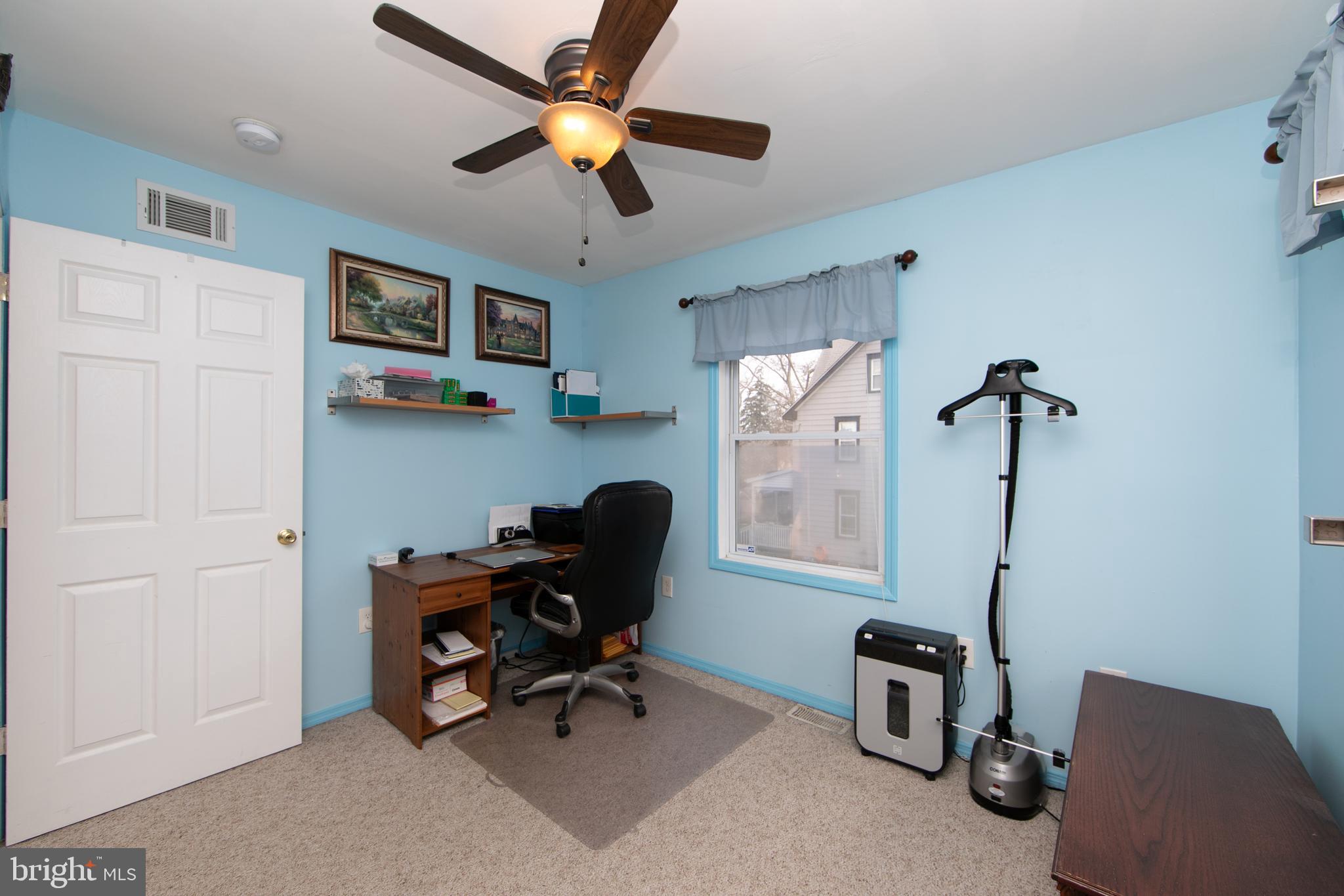614 West 5th Street Palmyra, NJ 08065 - Photo 23 of 30 a view of a workspace with furniture and a window
