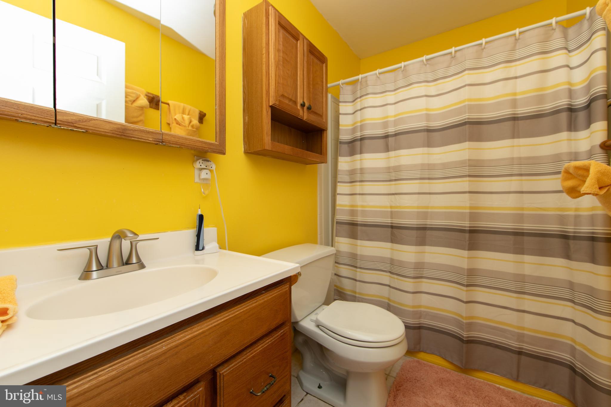 614 West 5th Street Palmyra, NJ 08065 - Photo 30 of 30 a bathroom with a sink a toilet and shower