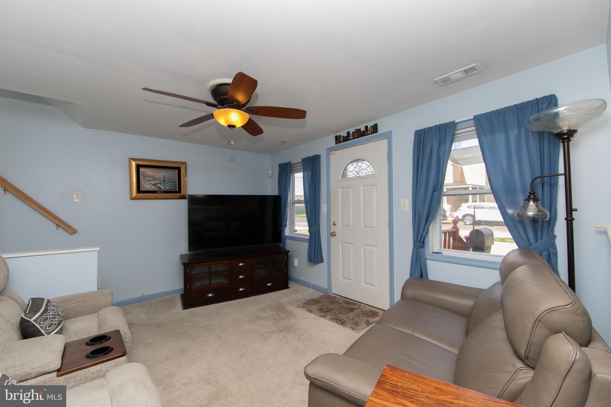 614 West 5th Street Palmyra, NJ 08065 - Photo 7 of 30 a living room with furniture and a flat screen tv