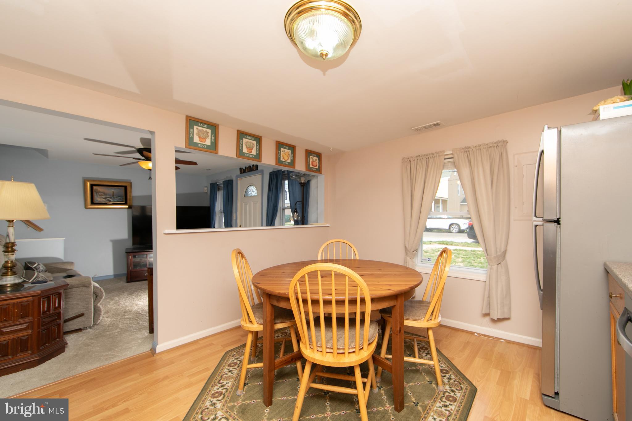 614 West 5th Street Palmyra, NJ 08065 - Photo 9 of 30 a view of a dining room with furniture and chandelier