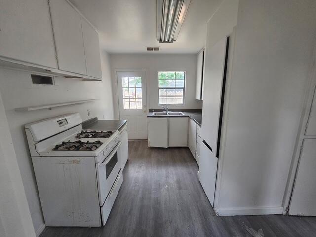 3218 Colgate Street Lubbock, TX 79415 - Photo 2 of 6 a kitchen with sink a stove and refrigerator