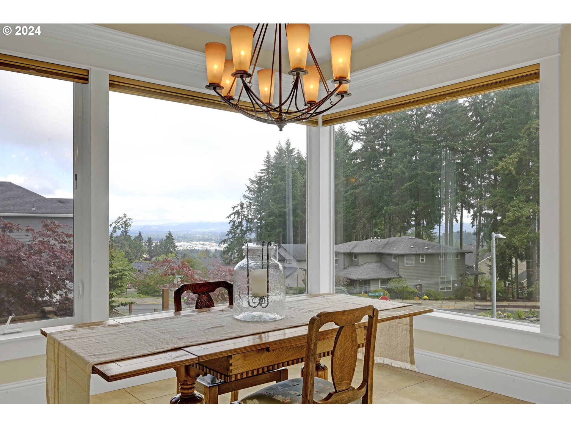 3587 Summit Sky Boulevard Eugene, OR 97405 - Photo 13 of 45 a view of a living room with a floor to ceiling window and wooden floor