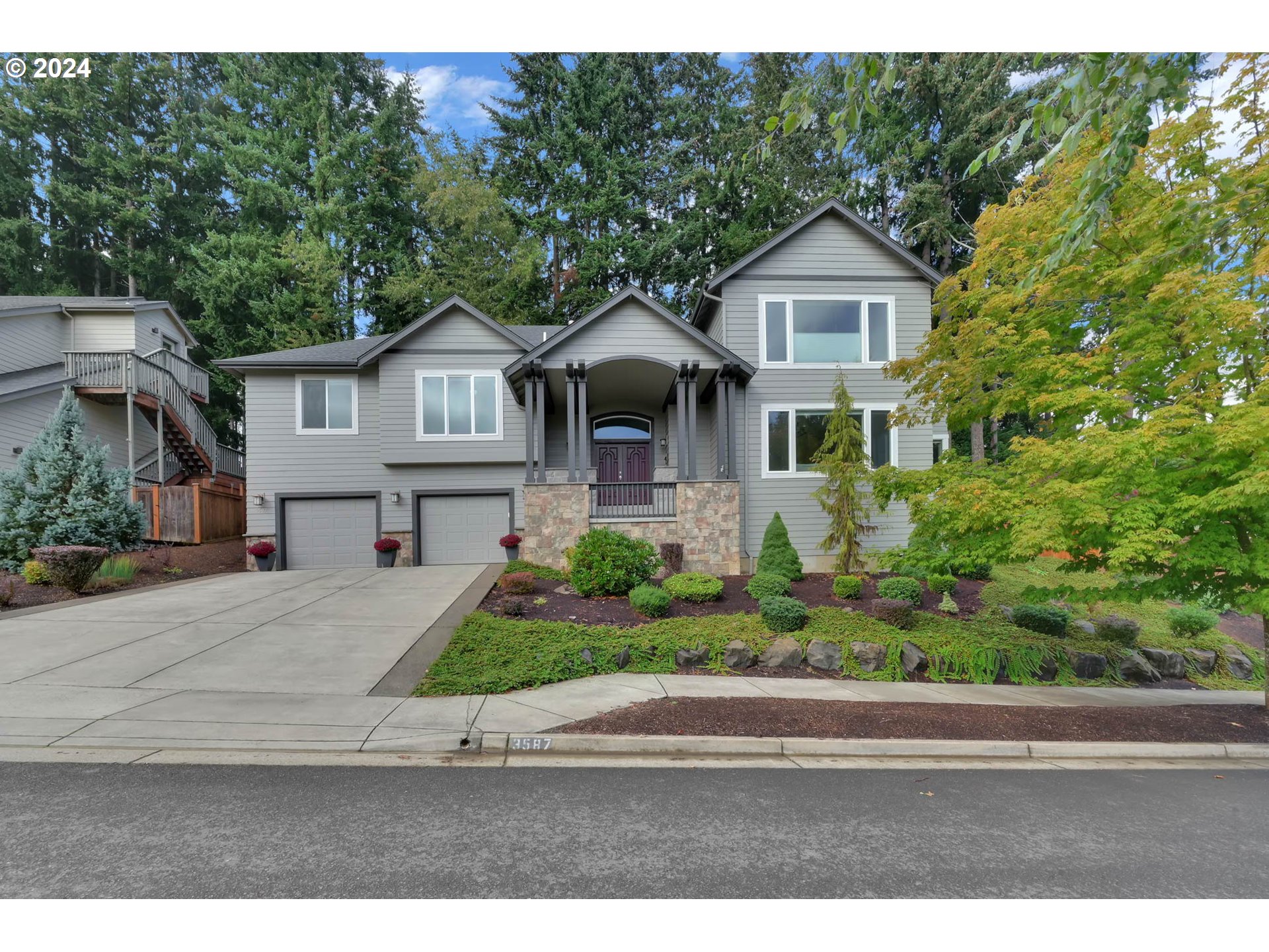 3587 Summit Sky Boulevard Eugene, OR 97405 - Photo 2 of 45 a front view of a house with a yard