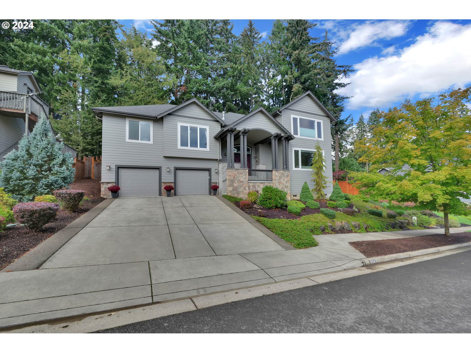 3587 Summit Sky Boulevard Eugene, OR 97405 - Photo 3 of 45 a front view of a house with a garden