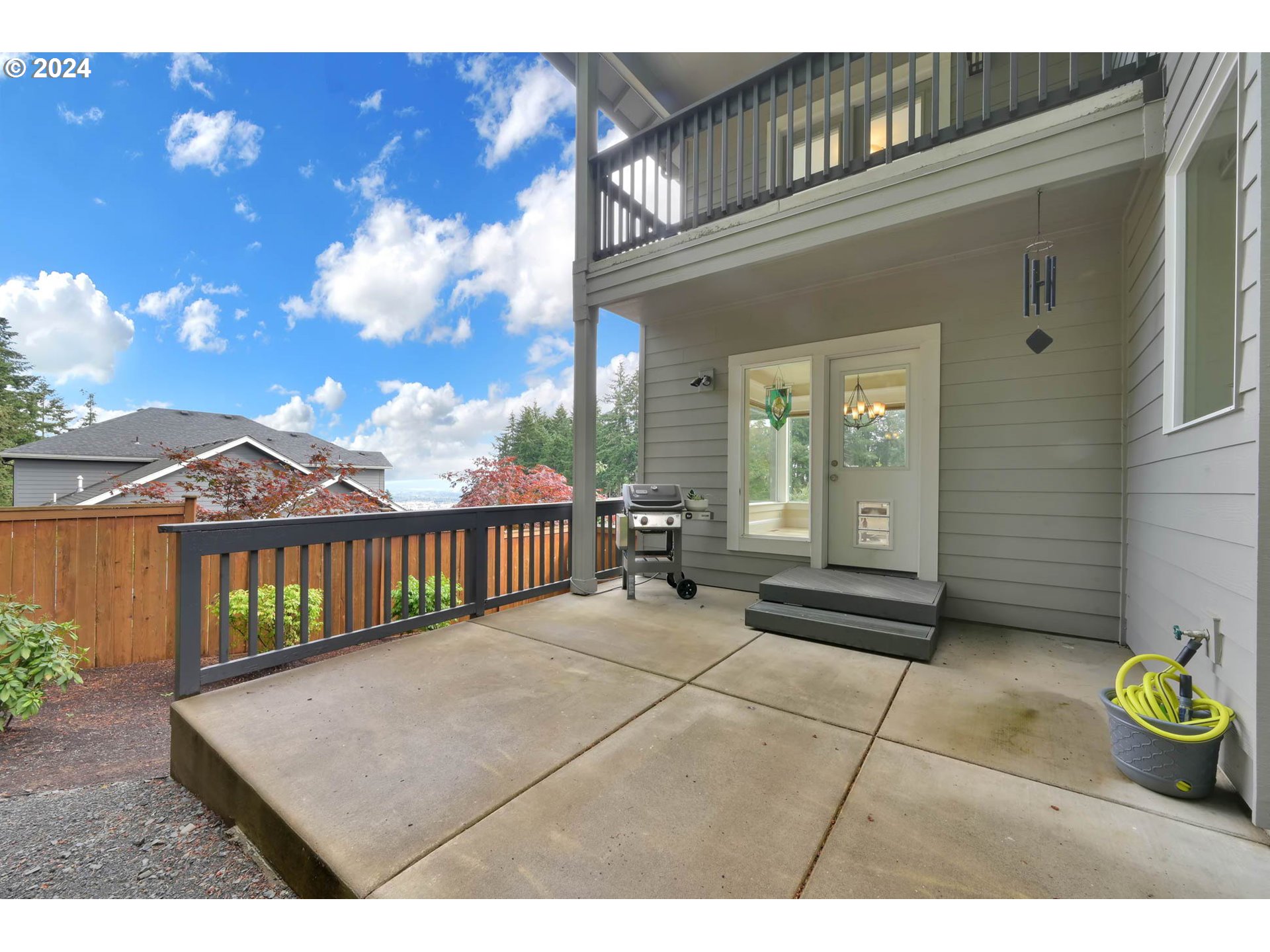 3587 Summit Sky Boulevard Eugene, OR 97405 - Photo 40 of 45 a view of a balcony with chair and table