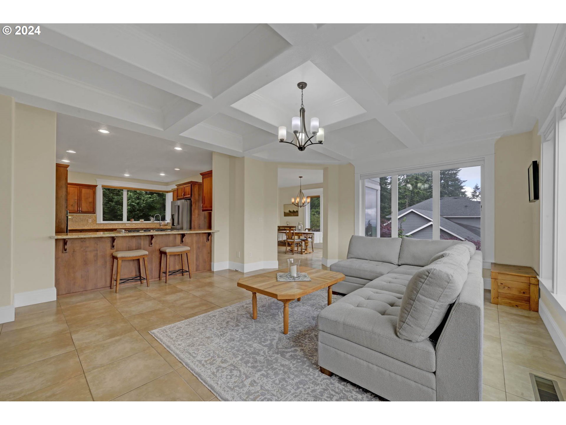 3587 Summit Sky Boulevard Eugene, OR 97405 - Photo 9 of 45 a living room with furniture and a dining table with kitchen view