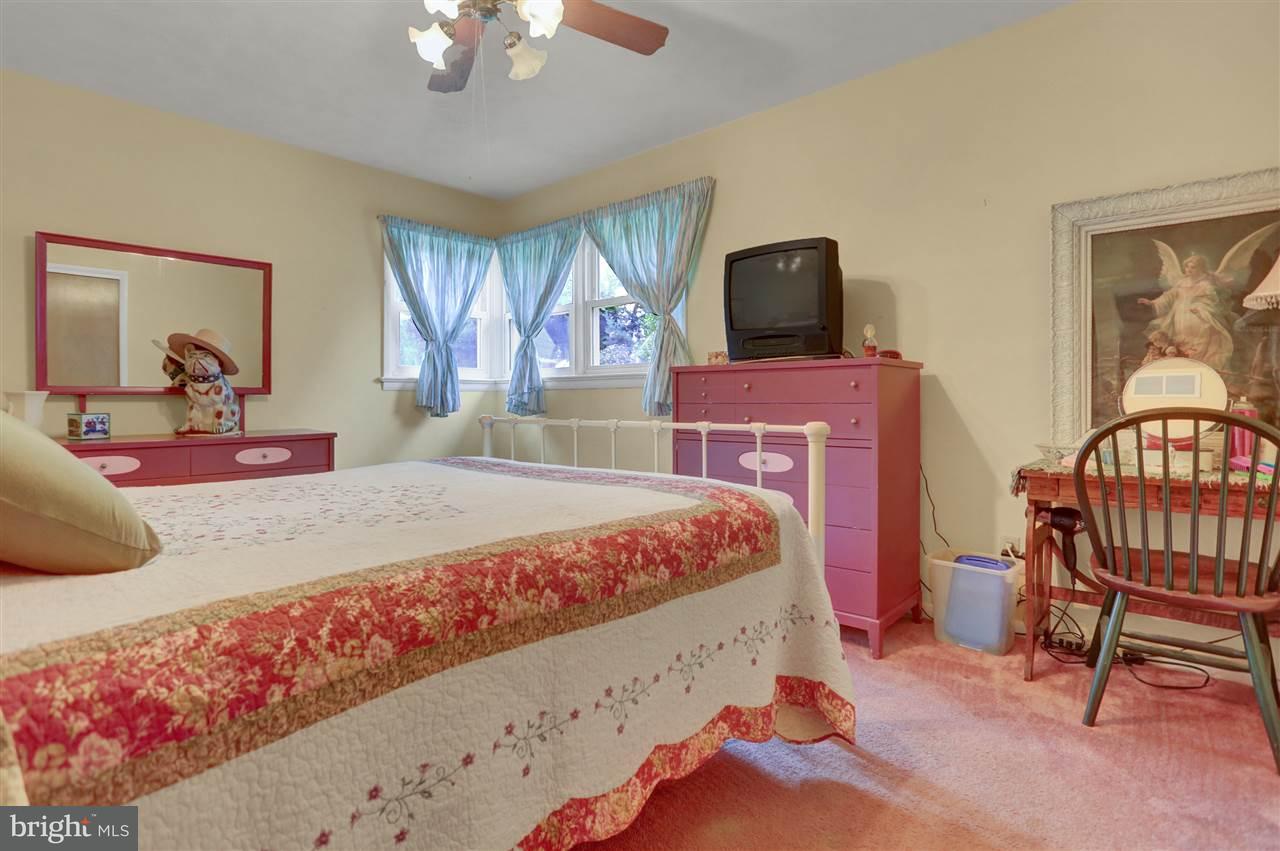 2238 Sycamore Road York, PA 17408 - Photo 19 of 32 a bedroom with a bed a window and dresser