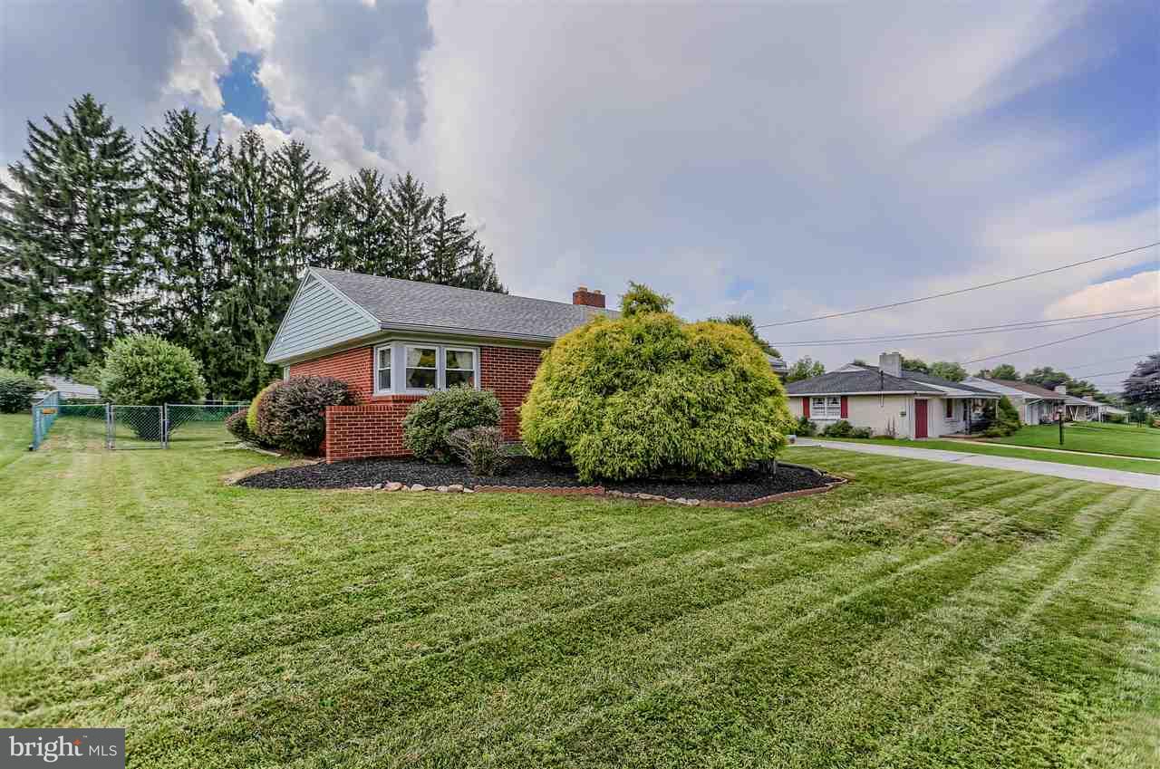 2238 Sycamore Road York, PA 17408 - Photo 2 of 32 a view of a house with a big yard and large trees