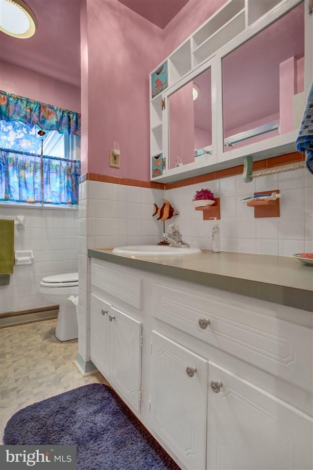 2238 Sycamore Road York, PA 17408 - Photo 25 of 32 a bathroom with a sink a toilet and mirror