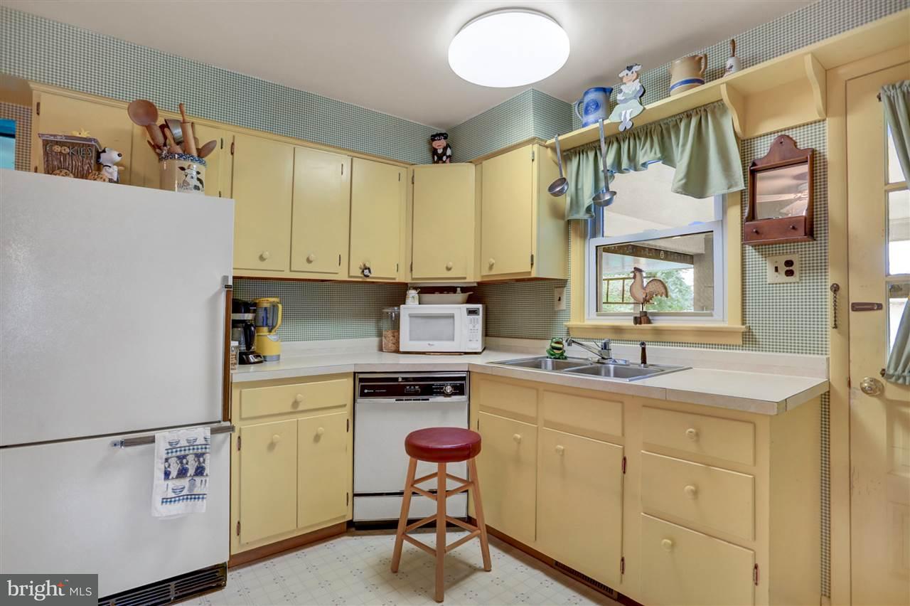2238 Sycamore Road York, PA 17408 - Photo 10 of 32 a kitchen with a sink a stove cabinets and counter space