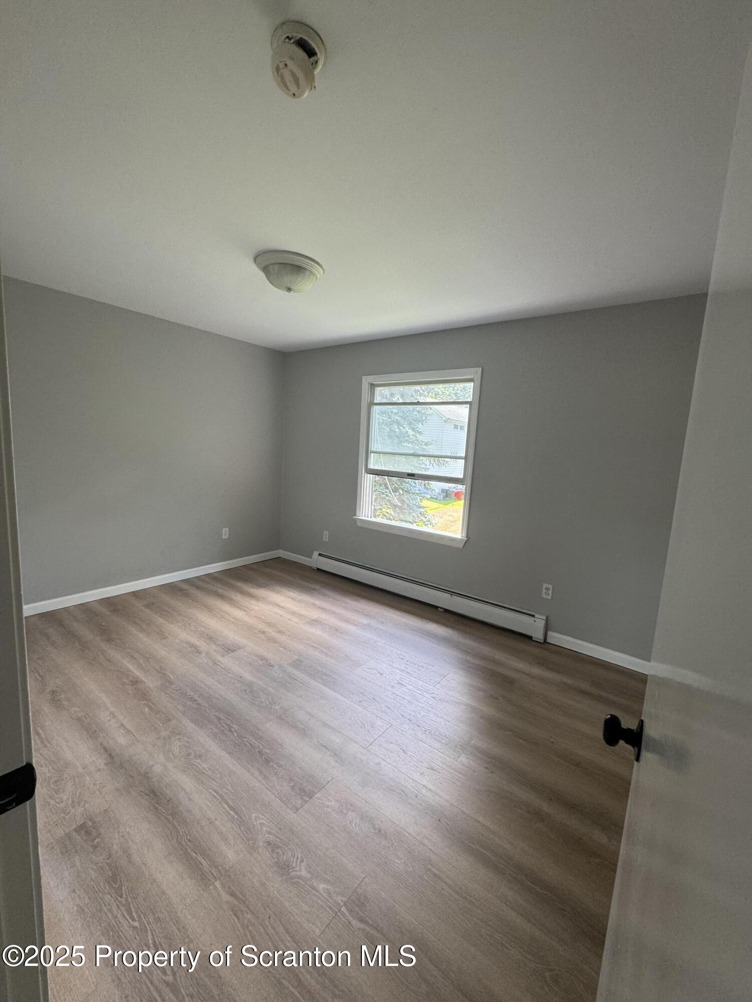 131 Smith Street, Unit 6 Dunmore, PA 18512 - Photo 11 of 13 an empty room with a window