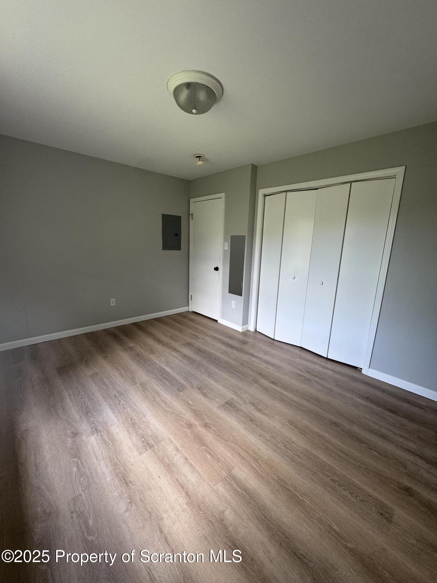 131 Smith Street, Unit 6 Dunmore, PA 18512 - Photo 9 of 13 a view of empty room with wooden floor