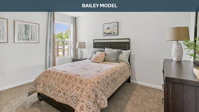 a bedroom with a bed and painting on the wall