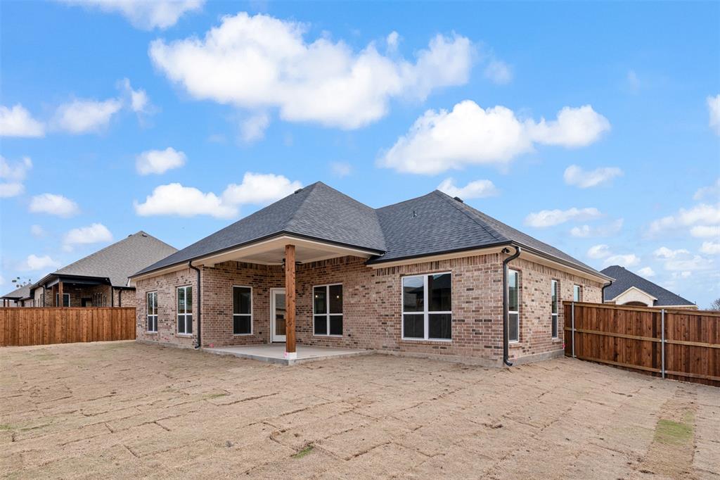506 Limestone Circle Mabank, TX 75147 - Photo 24 of 33 a front view of a house with yard and seating area