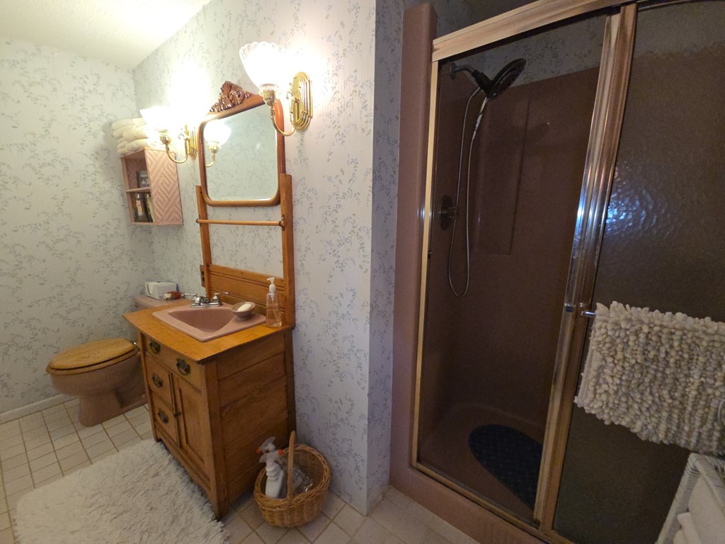 1405 Madison Road Templeton, PA 16259 - Photo 29 of 50 a bathroom with a sink a toilet and shower