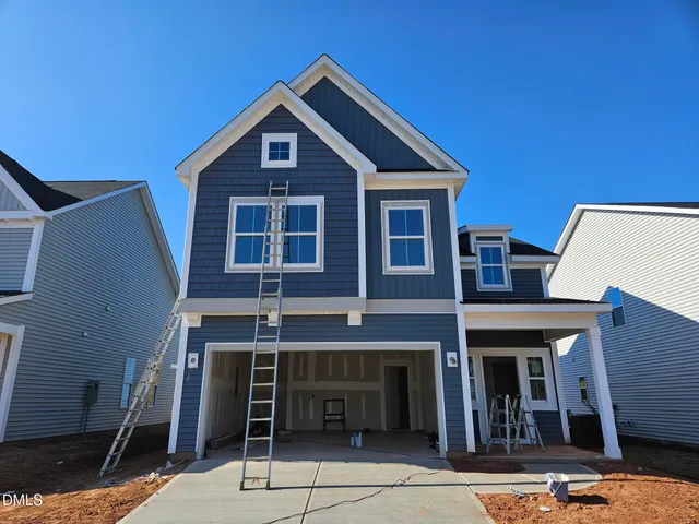a front view of a house with glass windows
