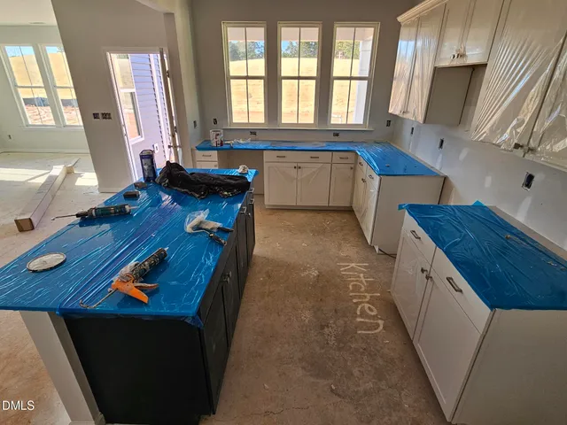 a view of empty room with windows