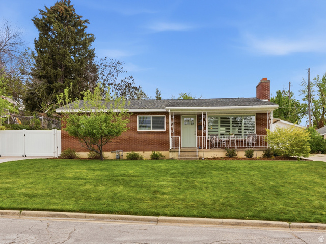 178 East 2450th Street South Bountiful, UT 84010 - Photo 1 of 1 Ranch-style house with brick siding, covered porch, a chimney, a gate, and an outbuilding