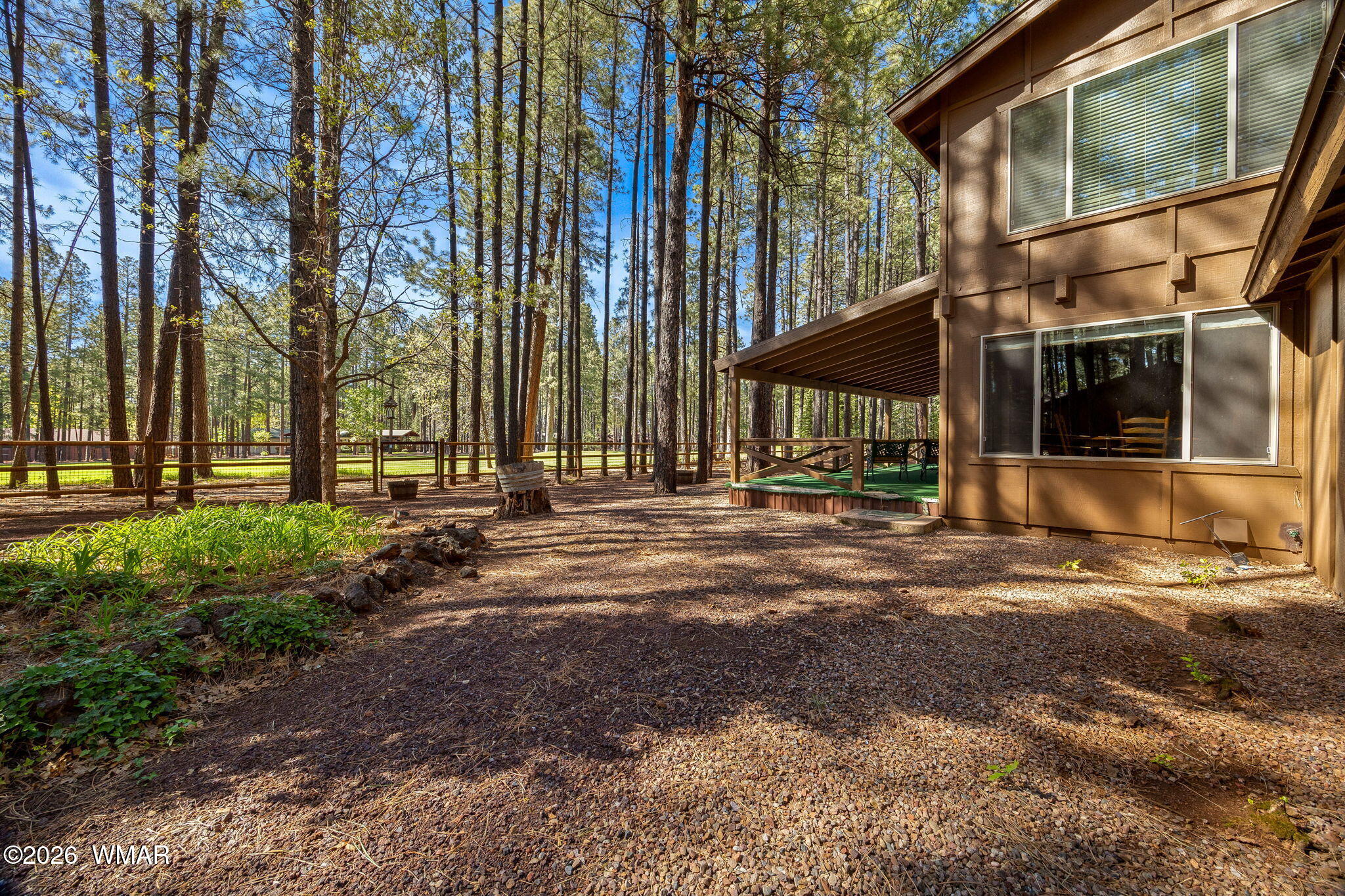 7456 Geronimo Road Pinetop, AZ 85935 - Photo 30 of 35 a backyard of a house with lots of green space