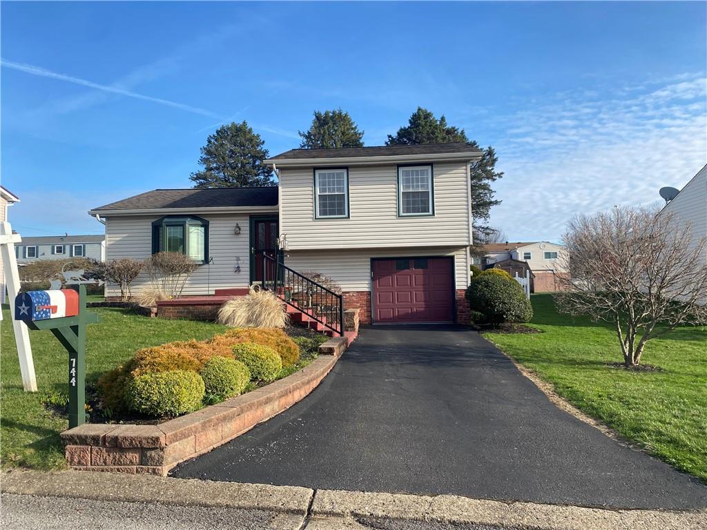744 North Gross Street Conway, PA 15027 - Photo 1 of 29 a front view of a house with garden