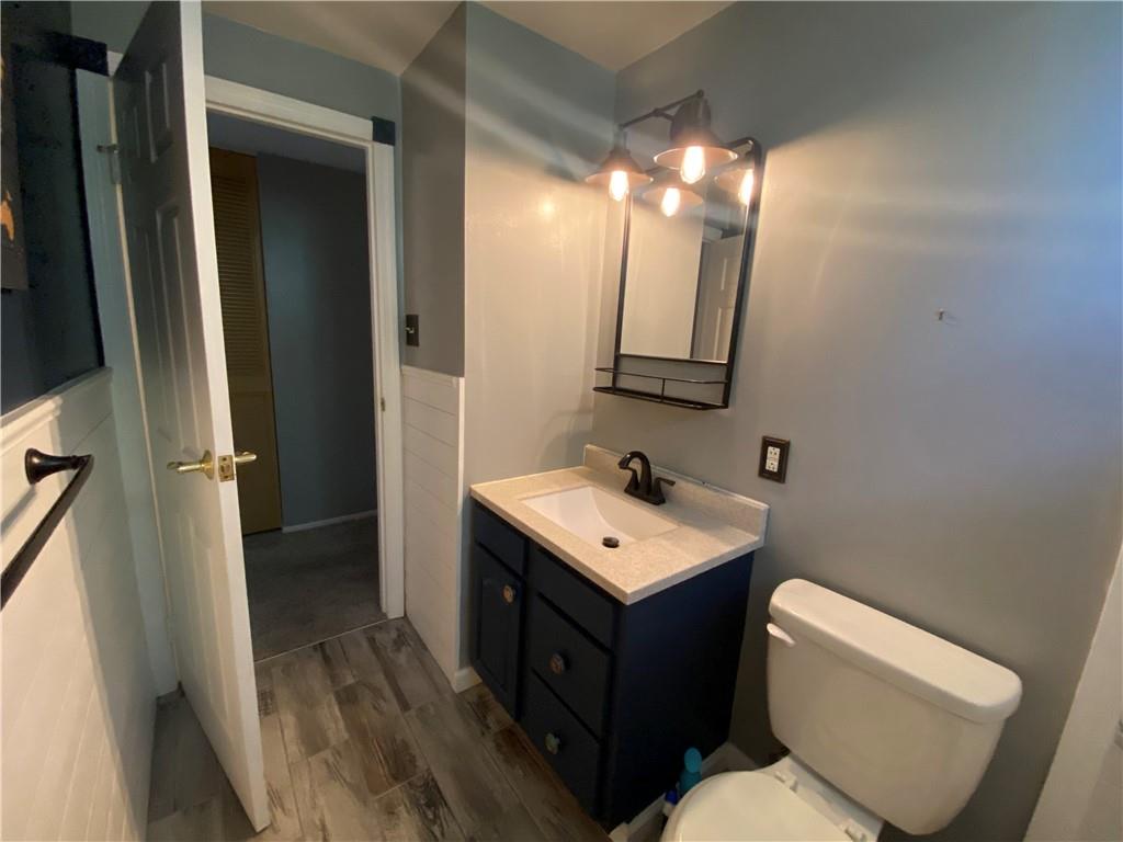744 North Gross Street Conway, PA 15027 - Photo 12 of 29 a bathroom with a toilet sink and mirror