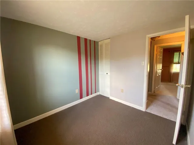a view of a room with a hallway