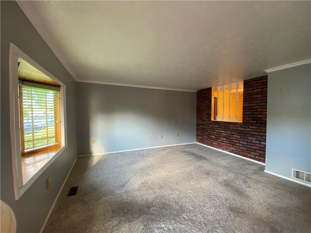 744 North Gross Street Conway, PA 15027 - Photo 3 of 29 an empty room with windows